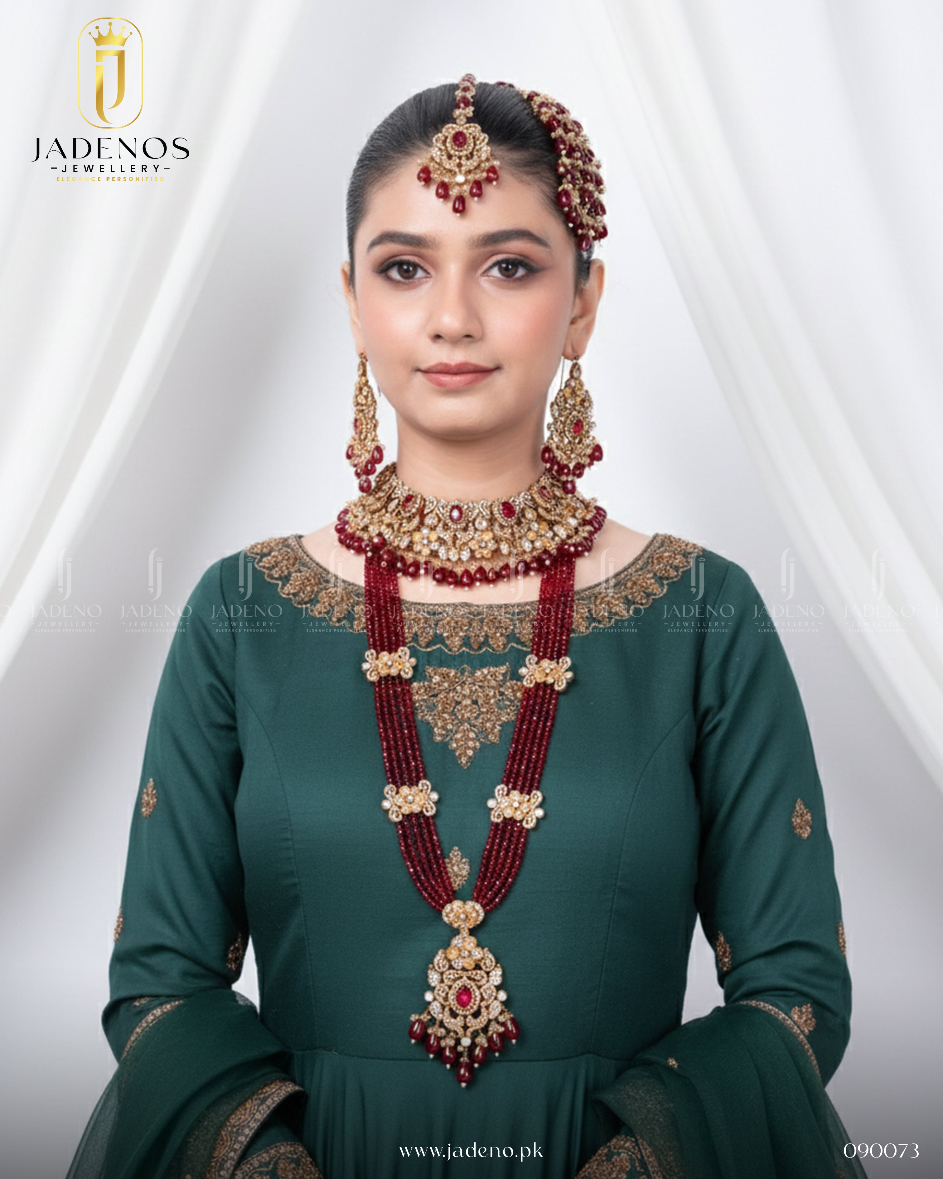 Model wearing Traditional Rangreza Bridal Set With Maala, Tika and Jhumar, featuring red beads, gold detailing, and bridal elegance