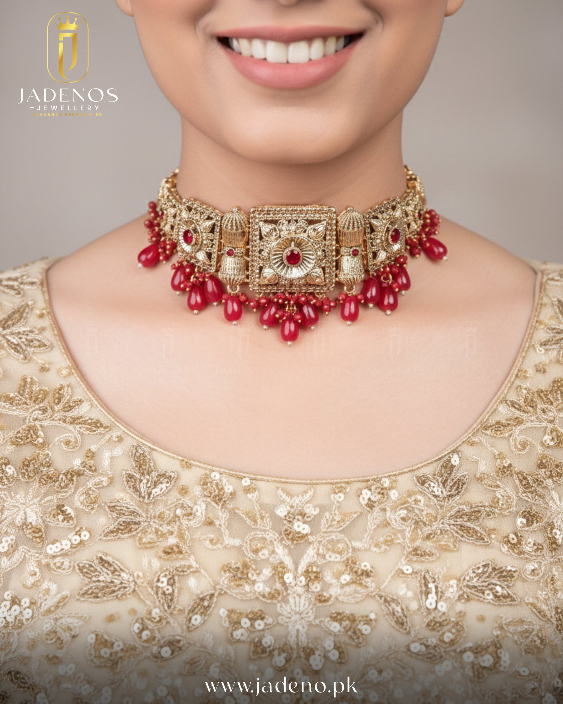 Statement look featuring Noor-e-Ronaq choker set with tika, gold choker with red stones and bead drops.