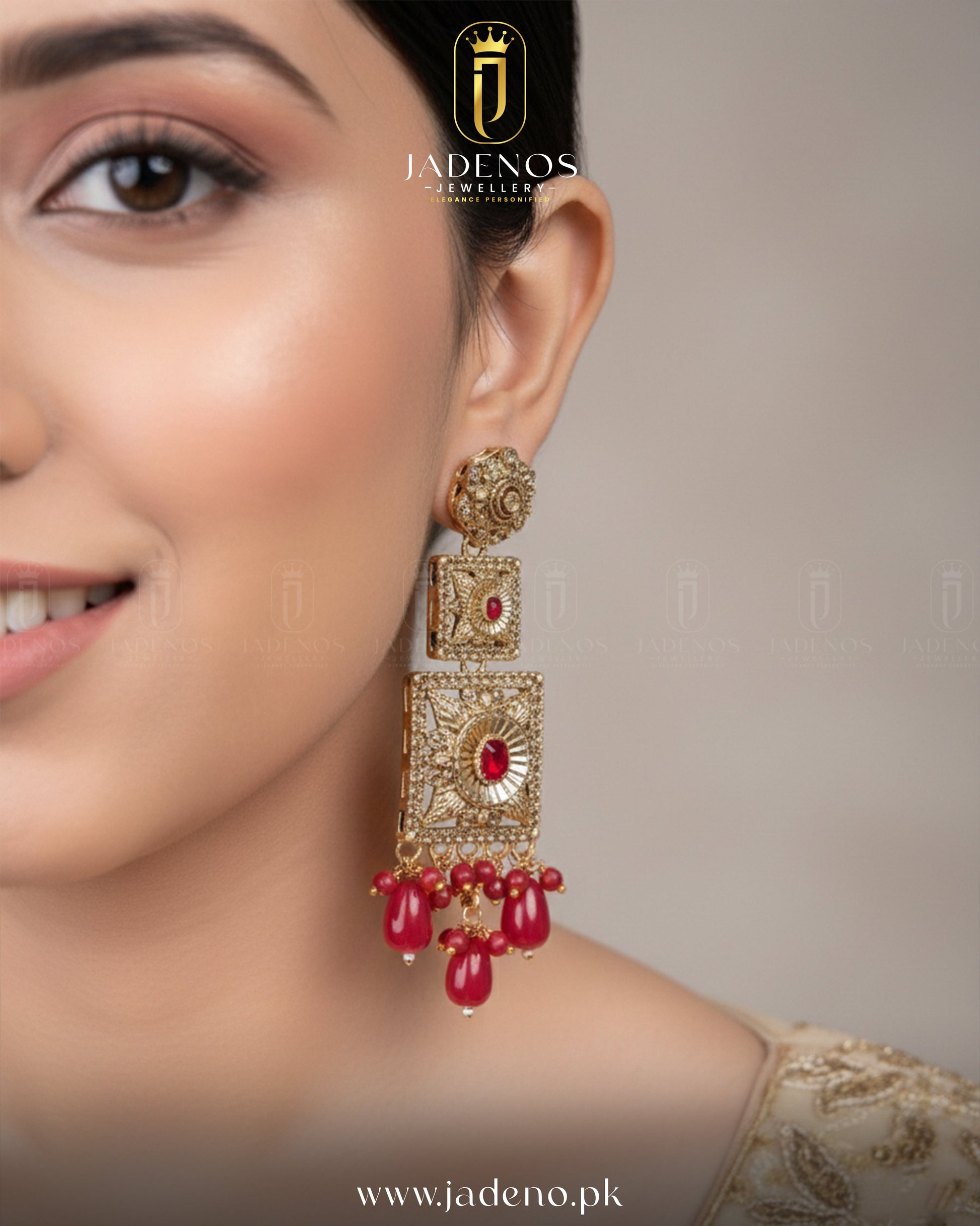 Side detail of Noor-e-Ronaq earrings, gold earrings with red stones and bead drops, best Pakistani jewelry design.